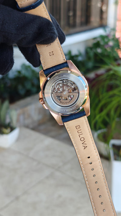 Bulova Sutton 97A161 – Automatic Skeleton Rose Gold & Blue