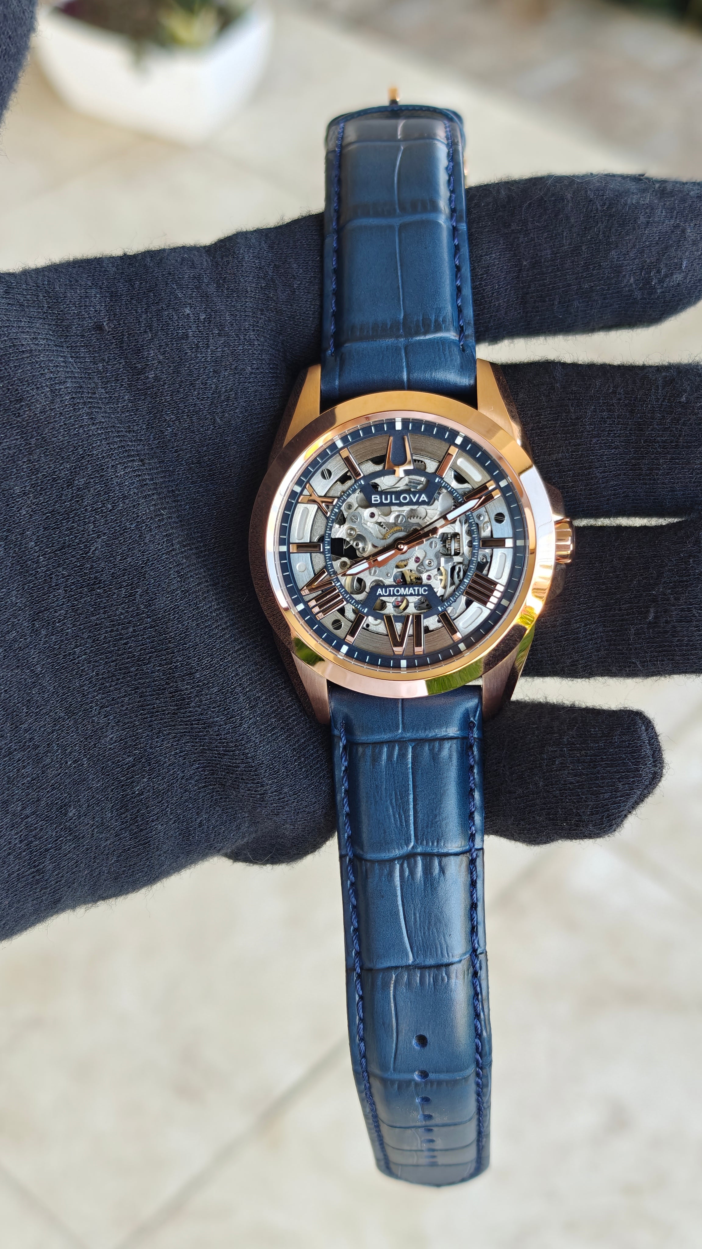 Bulova Sutton 97A161 – Automatic Skeleton Rose Gold & Blue